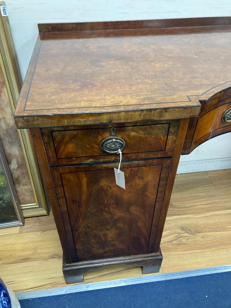 A George IV ebony banded concave front mahogany sideboard, length 173cm, depth 60cm, height 92cm